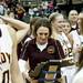 Manchester head coach Cori Kastel looks at the Class C state championship trophy after defeating Saginaw Nouvel 57-52 on Saturday, March 16. Daniel Brenner I AnnArbor.com